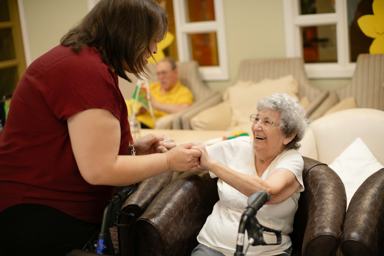 A caregiver sharing a warm moment with a resident
